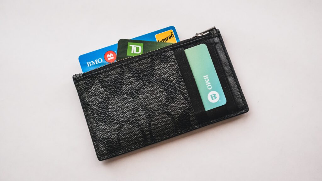 a wallet with credit cards sticking out of it